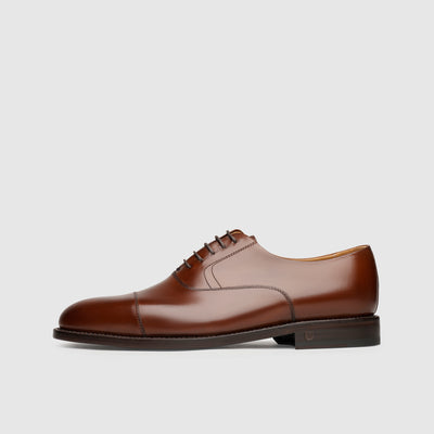 Goodyear welted men's shoes with stitched frames.