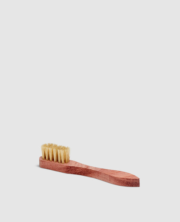 Sapphire brush with small white bristles