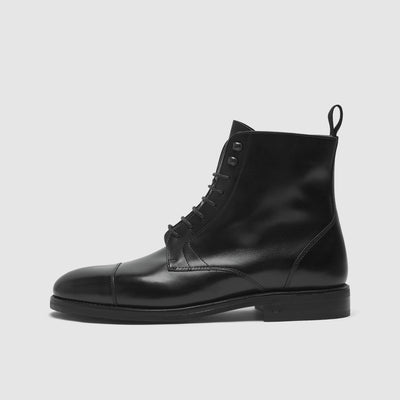 Text: Handcrafted men's boots
